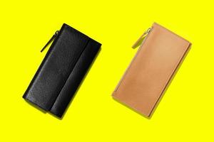 Fashionable leather women wallets on a yellow background. added copy space for text. photo