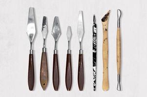 Set of different palette knife spatulas isolated on white background. photo