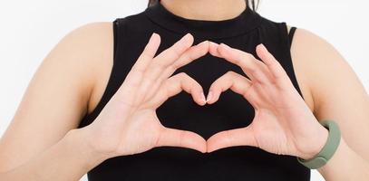 girl shows a heart-shaped gesture close-up. love theme.Top view. Mock up. Copy space. Template. Blank. photo