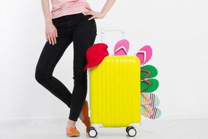 girl with suitcase isolated on white background .Summer holidays. summer flip flops or slippers. Travel valise or bag. Mock up. Copy space. Template. Blank. photo