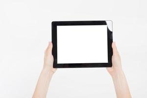 Hand holding black tablet isolated on white clipping path inside. Top view.Mock up.Copy space.Template.Blank. photo