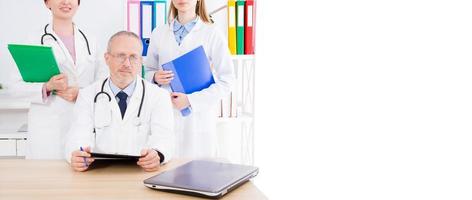 doctor with medical staff,nurse in office and copy space, banner of billboard photo