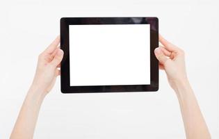 Hand holding black tablet isolated on white clipping path inside. Top view.Mock up.Copy space.Template.Blank. photo