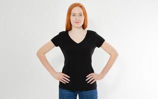 Beautiful red hair girl in a black t-shirt isolated on white. Pretty smile red head woman in tshirt mock up blank. photo