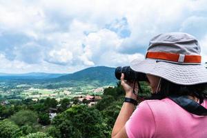 Tourists taking photo of natural scenery