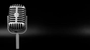 Retro microphone of silver on black background photo