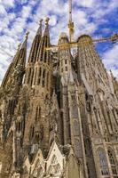 BARCELONA, SPAIN, OCTOBER 7, 2019 - Cathedral La Sagrada Familia in Barcelona, Spain. It is designed by architect Antonio Gaudi and built since 1882. photo