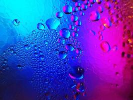 The dew in the cold glass with a gradation of blue and red. Abstract Macro Photography photo