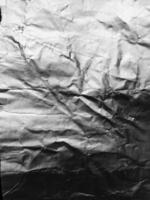 the surface of aluminium foil texture for background and design materials. crumpled texture collection of silver foil. abstract wrinkled pattern background. photo