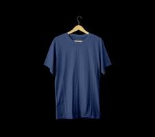 Short-sleeved Blue t-shirts for mockups. plain t-shirt with black background for design preview. t-shirt on hanger for display. photo