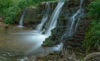waterfall in the summer river photo