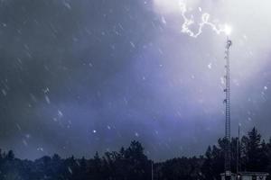 Lightning hitting telecom tower photo