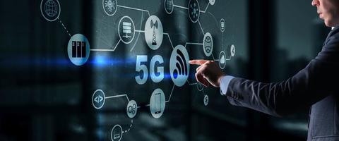 5G Network Wireless Internet concept. Man touching 3D icon 5G photo