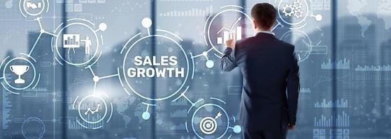 Sales Growth Man clicks inscription on virtual 3D screen photo