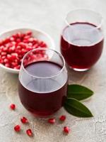 Pomegranate juice with fresh pomegranate fruits photo