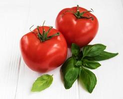 Tomato and green basil photo