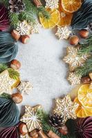 Christmas decorations with  fir branches border, gingerbread  cookies and paper baubles photo