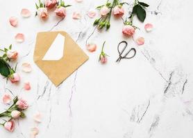 Pink roses and envelope photo