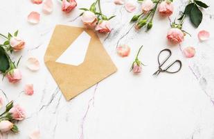 Pink roses and envelope photo