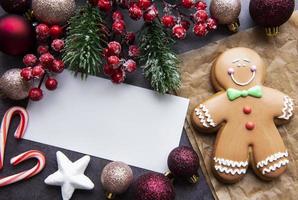 Christmas gingerbread cookies on dark background photo