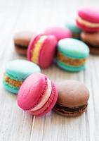 Colorful macaroons on a table photo