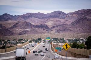 Las Vegas, Nevada- Las Vegas city surrounded by Red Rock mountains and Valley of Fire photo