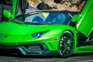 Green Italian Lamborghini car in parking lot at Hoover Dam photo