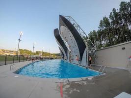 Charlotte, NC, 2021 - Wall climbing over deep pool at national center in Charlotte photo