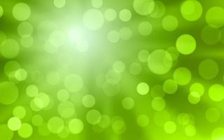 Blur green bokeh abstract background with sunburst vector