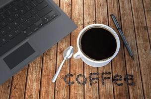Coffee cup and notebook on wood table. 3D rendering photo