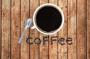 Coffee cup and coffee beans on wood table . 3D rendering photo