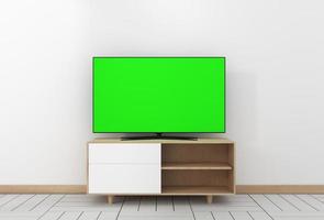 Maqueta de Smart TV con pantalla verde en blanco colgada en el interior de una habitación vacía blanca moderna con diseños mínimos. Representación 3d foto