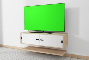 Maqueta de Smart TV con pantalla verde en blanco colgada en el interior de una habitación vacía blanca moderna con diseños mínimos. Representación 3d foto