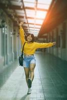 happiness asian girl walking at city street shopping photo