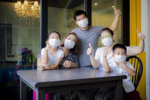 asian family quarantine at home while corona virus ,covid-19 infected period photo