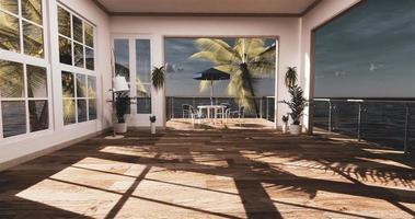 Sea view living room in modern beach summer home. 3D rendering photo