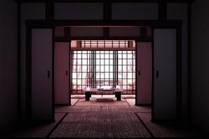 diseño original - interior de la habitación con ventana con vista al árbol de sakura, estilo japonés. Representación 3d foto