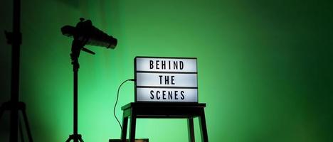 Movie board light box on studio stair and light Snoot tripod on colors gradiant Background. photo