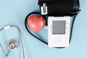 Medical Examination and Health Awareness Concept, Health Checkup With Measuring Blood Pressure Sphygmomanometer and Medical Stethoscope. Doctor Appointment for Medical Exam and Healthcare Consulting photo