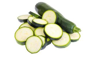 Zucchini chopped slices on white background as package design element photo