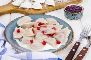 Dumplings with pastry stuffed with fresh berries. photo