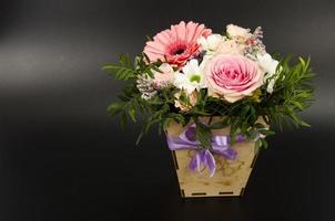 Flowers, bouquet in stylish wooden box. Studio Photo