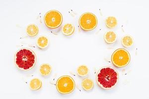 cut organic citrus fruits with petals photo