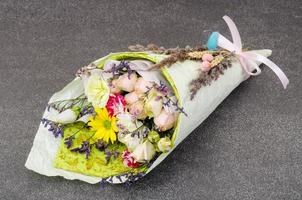 Creative holiday bouquet of fresh and dried flowers photo