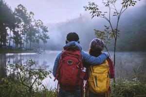 Couple lovers travel Beatiful nature at Pang ung lake and pine forest at Mae Hong Son in Thailand. photo