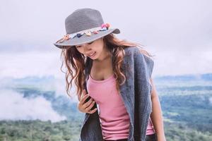 Asian women travel relax in the holiday. Standing on the mountain. Thailand photo