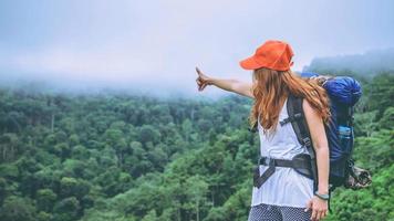 Asian women travel relax in the holiday. Standing on the mountain. Thailand photo