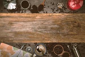 Brown coffee beans And a cup of hot coffee placed on a wooden table. Concept travel with map. Time to relax with a cup drink of good coffee. Top view copy space for your text. photo