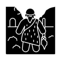 Caveman glyph icon. Prehistoric man with beard. Primeval hunter with spear. Neanderthal in old age. Ancestor standing with weapon. Silhouette symbol. Negative space. Vector isolated illustration