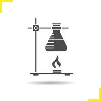 Chemical reaction glyph icon. Drop shadow silhouette symbol. Ring stand with flask over fire. Negative space. Vector isolated illustration